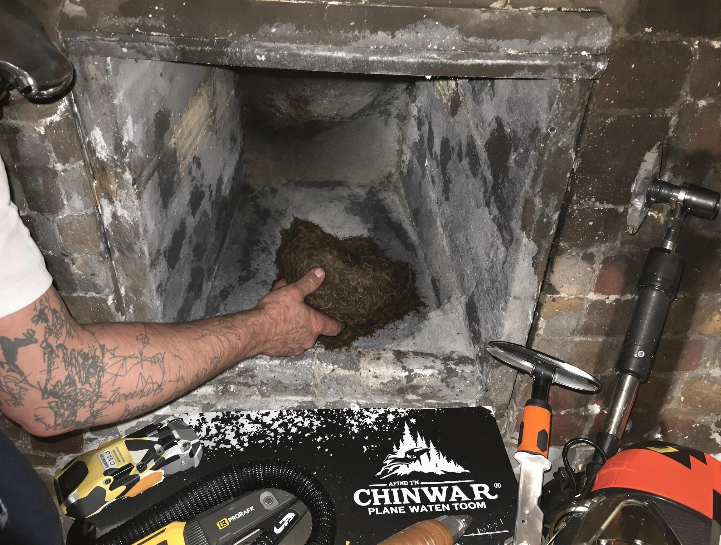 Syracuse Chimney Sweep safely removing debris and screening chimney in Syracuse, UT
